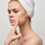 beautiful-woman-bare-shoulders-dermatology-isolated-background-photo